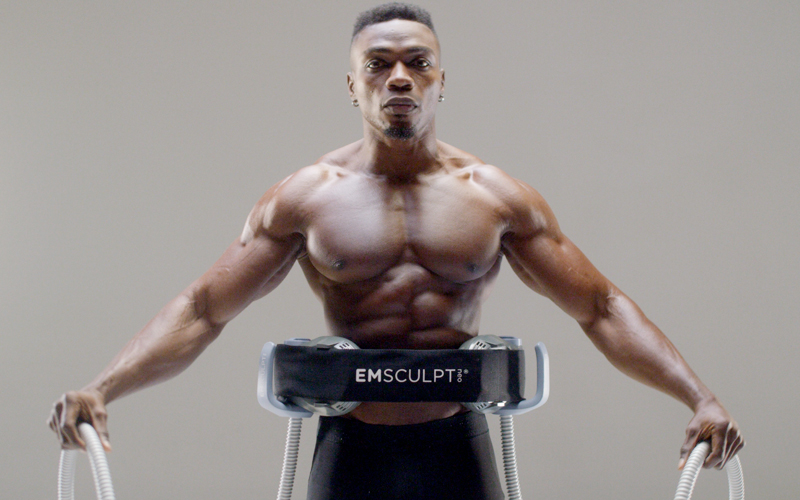 EmSculpt Neo equipment used on male body